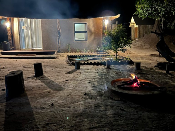 Cozy night at a rustic retreat, with a warm fire and peaceful surroundings.