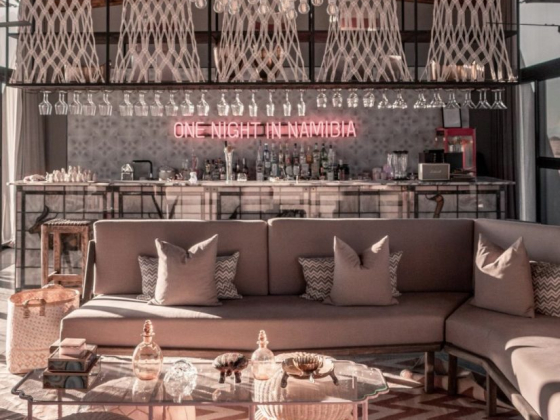 Chic interior space featuring cozy seating and a bar.