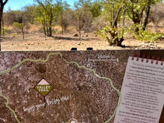 Sign indicating the walking trail route and guidelines.