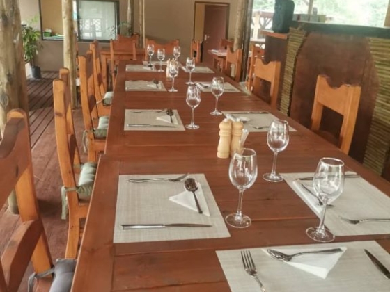 Elegant dining setup with rustic charm, inviting guests for a memorable meal.