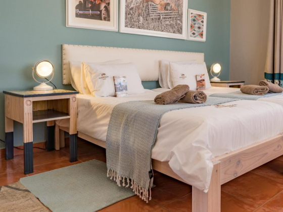 Inviting space featuring modern decor and comfortable bedding.