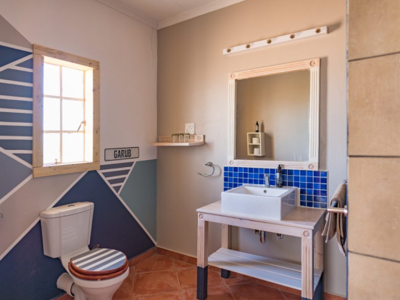 Stylish bathroom featuring a sink and colorful decor.